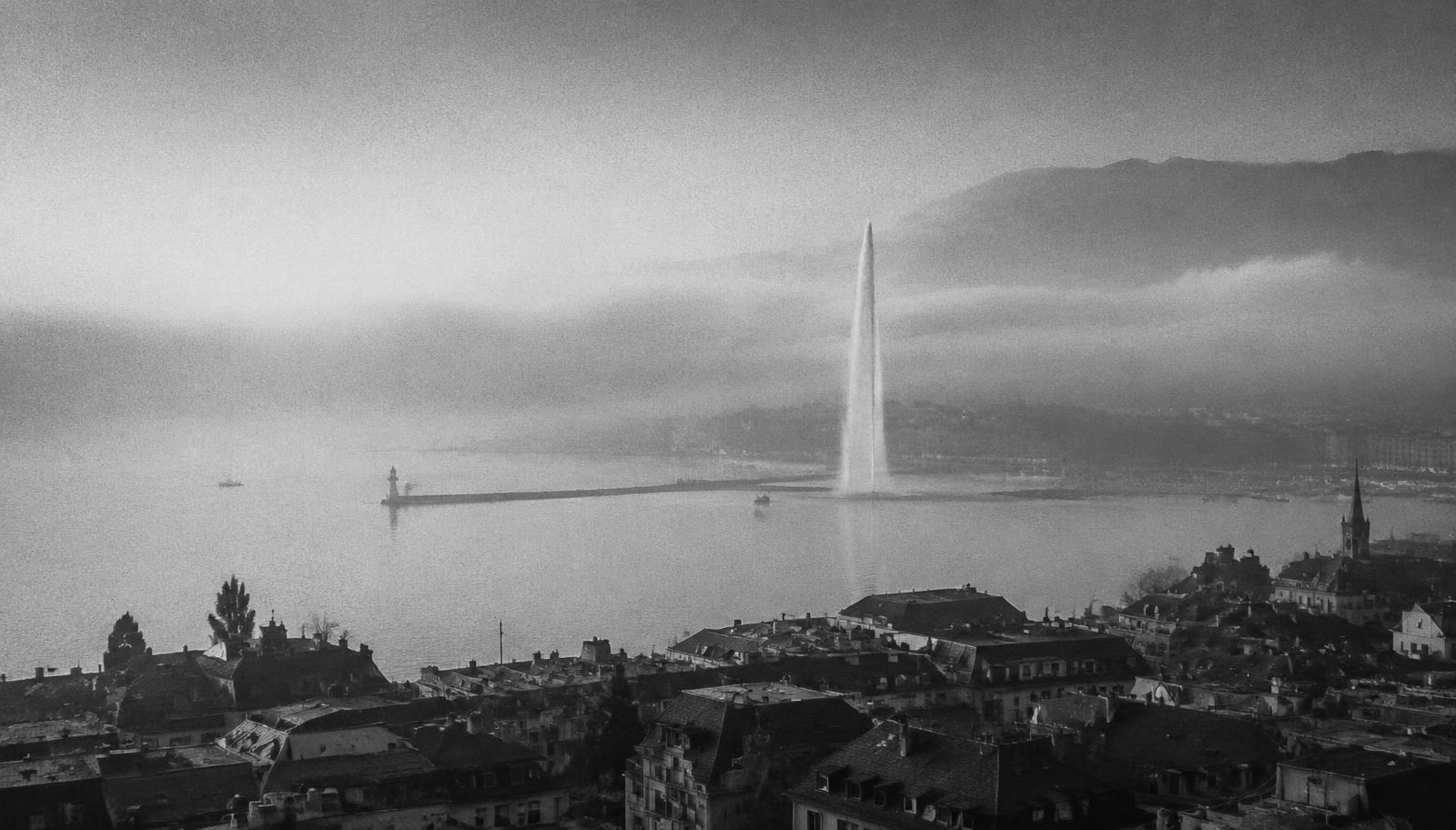 Lake Geneva and the Jet d'Eau in morning fog